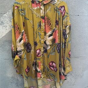 Free People button down. Fits up to large. Mustard colored with large flowers.